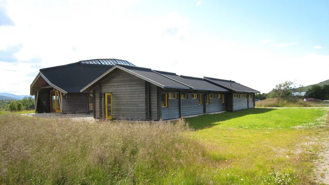 A photo of a log school