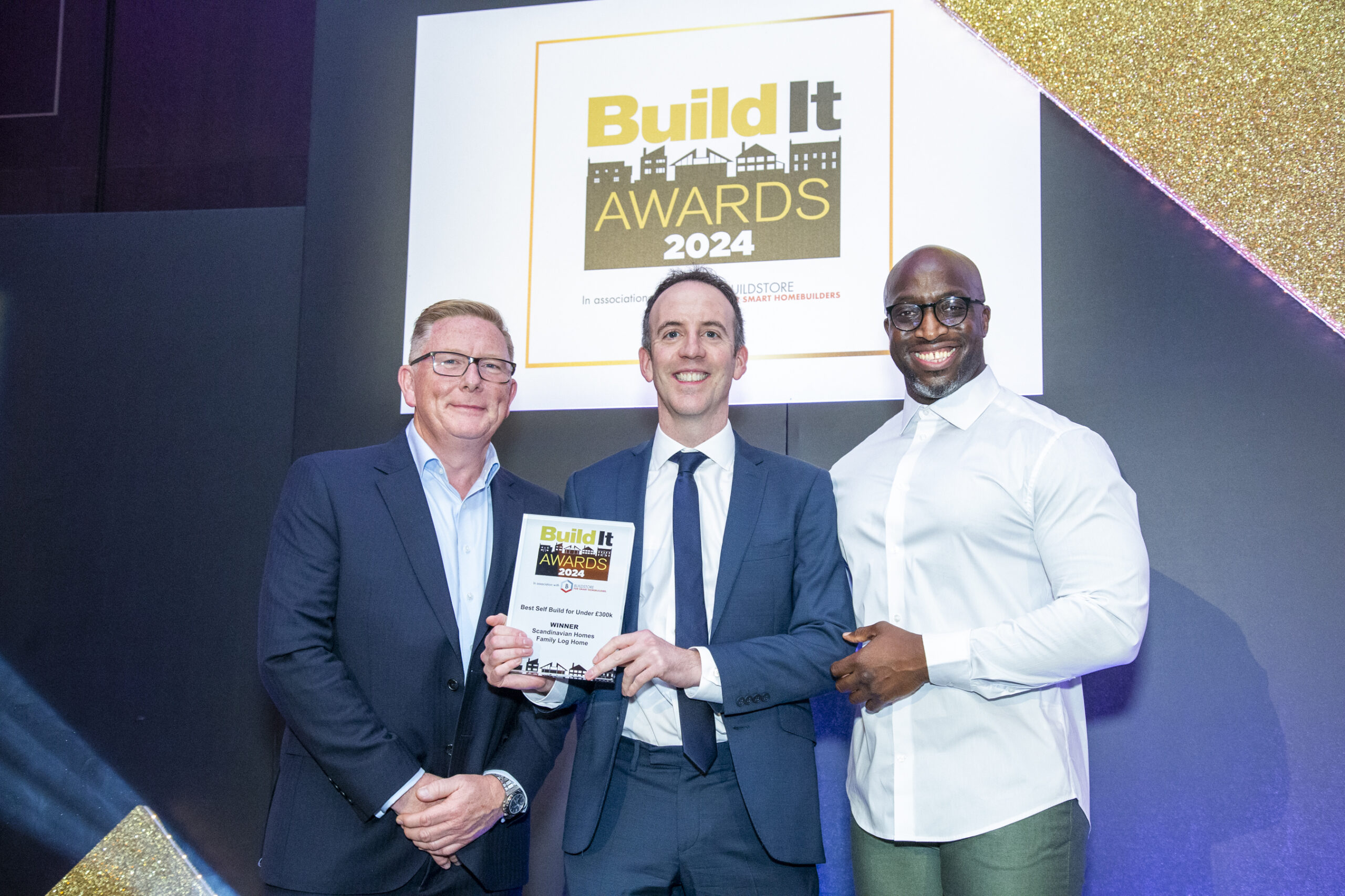 Build It planning specialist accepts the award on behalf of Scandinavian Homes